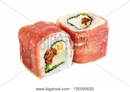 Uramaki maki sushi with prosciutto crudo, two rolls isolated on white. Letuce, philadelphia cheese, dried tomatoes, parmigiano