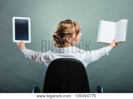 Woman Holding Traditional Book And E-book Reader