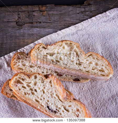 ciabatta fresh bread fresh ciabatta on the table. Italian ciabatta bread cut in slices.