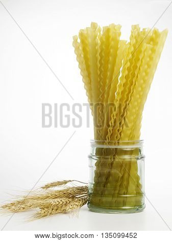 lasagnette in a jar on the white background