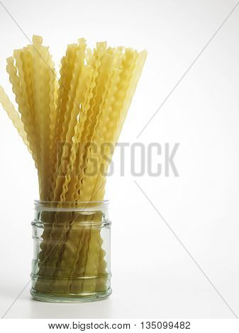 lasagnette in a jar on the white background