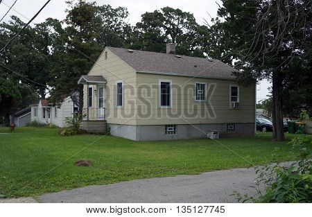 SHOREWOOD, ILLINOIS / UNITED STATES - AUGUST 30, 2015: A small Cape Cod style home in Shorewood, Illinois.