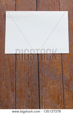 white paper on a wood tenture background
