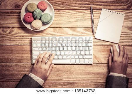 Top view of businesswoman hands using keyboard and mouse