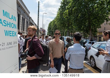 MILAN ITALY - JUNE 18: Fashionable people gather outside Marni fashion show building for Milan Men's Fashion Week on JUNE 18 2016 in Milan.