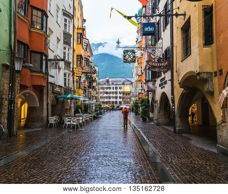 INNSBRUCK AUSTRIA - 18TH JUNE 2016: A view along Herzog Friedrich Strasse towards the Golden Roof building. People can be seen.