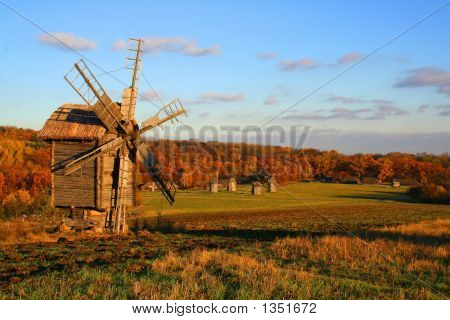 Windmills Over Autumn Meadow