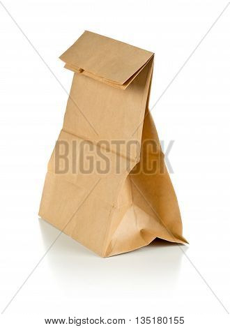 Clean brown paper doggy bag from recycled paper on white background