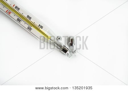 broken glass thermometer isolated on white background