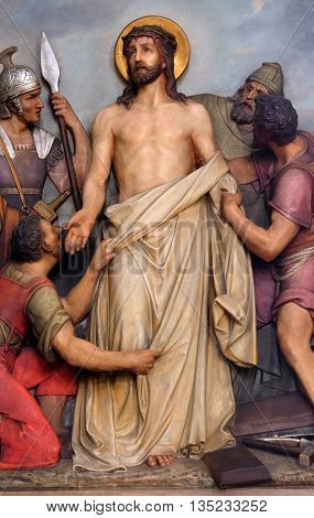 ZAGREB, CROATIA - SEPTEMBER 14: 10th Stations of the Cross, Jesus is stripped of His garments, Basilica of the Sacred Heart of Jesus in Zagreb, Croatia on September 14, 2015
