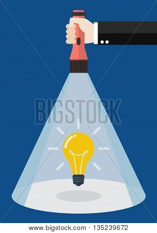 Hand holding flashlight glow to lightbulb idea. Search in business