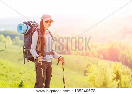 Young Backpacker Woman Standing At The Top Of Hill