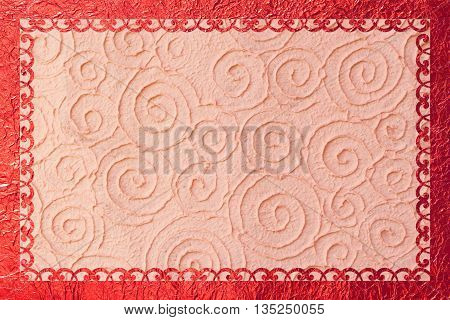 Shiny gold frame with a pattern on the foil background.