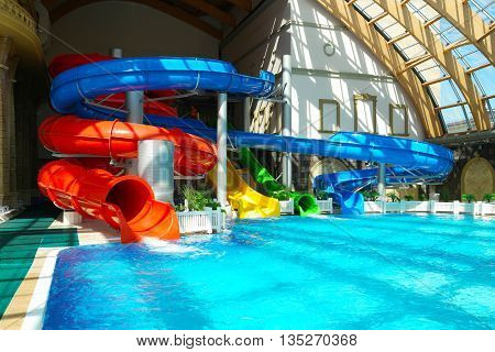 RUSSIA MOSCOW - JUNE 4, 2016: Multi-colored water slides in a water park