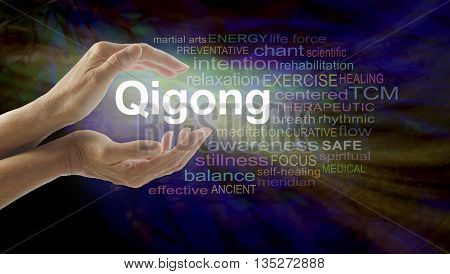Gigong word cloud and healing hands - female cupped hands with the word QIGONG between surrounded by word cloud on a multicolored light centered dark background