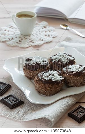 A photo of chocolate cakes and a cup of coffee