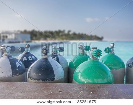 Closeup of immersion tanks on tropical sea background