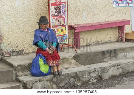 ALAUSI, ECUADOR, OCTOBER - 2015 - Native ecuadorian indigenous woman dressing traditional clothes in Alausi Ecuador
