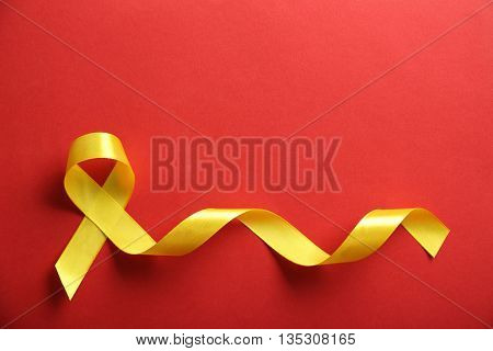 Yellow ribbon on red background