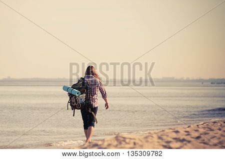 Man Hiker With Backpack Tramping By Seaside