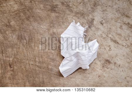 Crumpled Paper On Wood Background