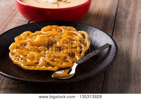jalebi with rabdi made from condensing milk, famous dessert sweet from India