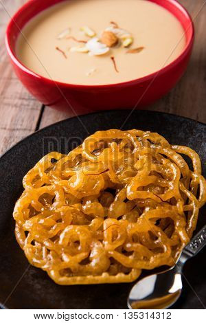 jalebi with rabdi made from condensing milk, famous dessert sweet from India