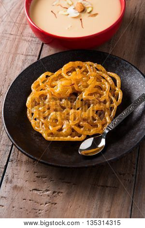 jalebi with rabdi made from condensing milk, famous dessert sweet from India