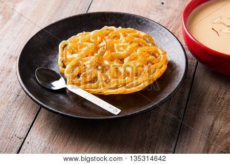 jalebi with rabdi made from condensing milk, famous dessert sweet from India