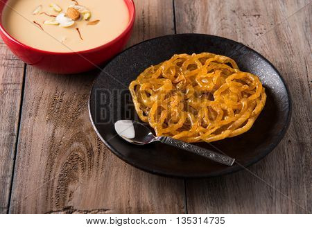 jalebi with rabdi made from condensing milk, famous dessert sweet from India