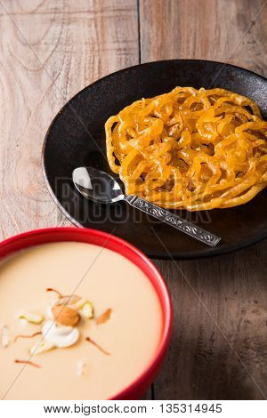 jalebi with rabdi made from condensing milk, famous dessert sweet from India