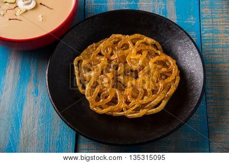 jalebi with rabdi made from condensing milk, famous dessert sweet from India