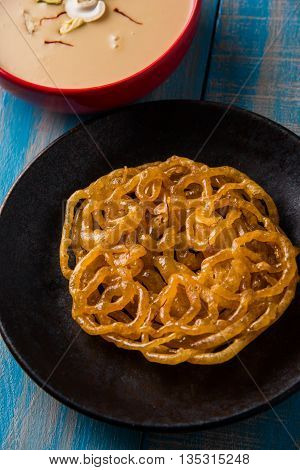 jalebi with rabdi made from condensing milk, famous dessert sweet from India