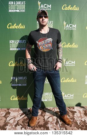ARLINGTON, TX - APR 18: Austin Webb attends the ACM & Cabela'??s Great Outdoor Archery Event during the 50th Academy Of Country Music Awards at the Texas Rangers Youth Ballpark on April 18, 2015.