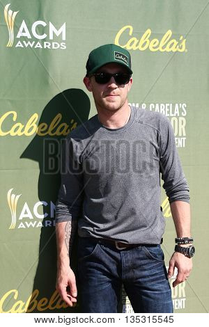 ARLINGTON, TX - APR 18: Justin Moore attends the ACM & Cabela'??s Great Outdoor Archery Event during the 50th Academy Of Country Music Awards at the Texas Rangers Youth Ballpark on April 18, 2015.