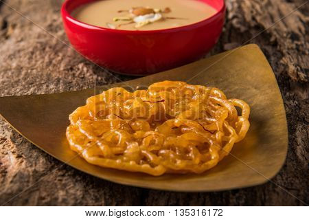 jalebi or imarati with rabdi made from condensing milk, famous dessert sweet from India