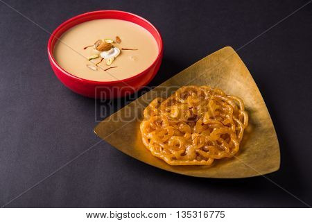 jalebi or imarati with rabdi made from condensing milk, famous dessert sweet from India