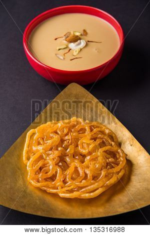 jalebi or imarati with rabdi made from condensing milk, famous dessert sweet from India