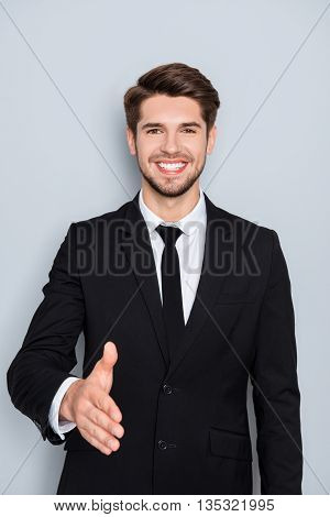 Businessman Giving Hand For Handshake To Make Finansial Deal