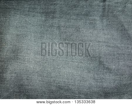 Texture of grey jeans for background .
