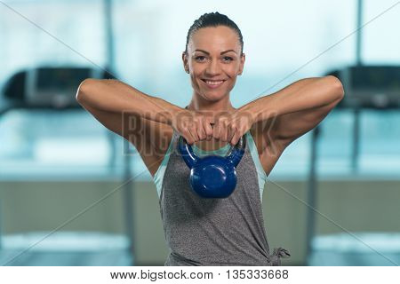 Fitness Woman Doing Exercise With Kettle Bell