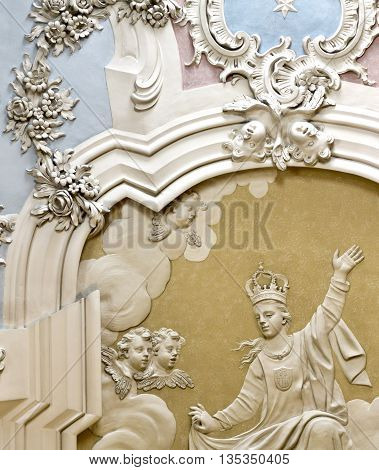 OEIRAS, PORTUGAL - November 4, 2015: Detail of the magnificent rococo stucco covering the ceiling of the Chapel of Our Lady of Mercy in the Palace of Oeiras on November 4, 2015 in Oeiras, Portugal