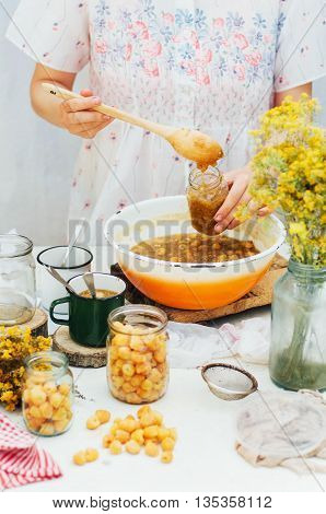 Raspberries Jam. Female Hand Making Jam, On A Rustic White Table