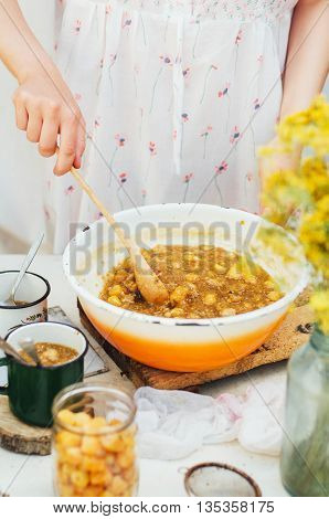 Raspberries Jam. Female Hand Making Jam, On A Rustic White Table
