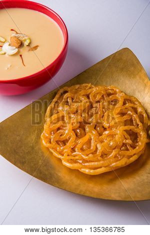 jalebi or imarati with rabdi made from condensing milk, famous dessert sweet from India