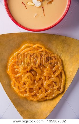 jalebi or imarati with rabdi made from condensing milk, famous dessert sweet from India