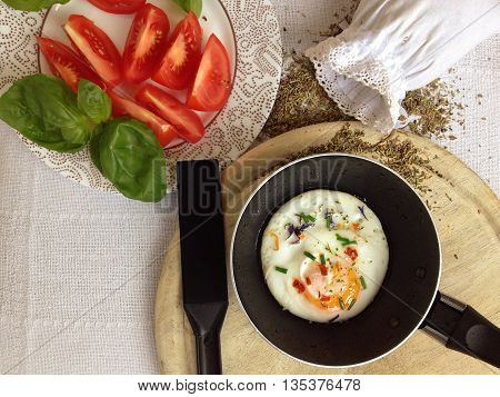 Healthy tasty breakfast with fried egg, tomatoes