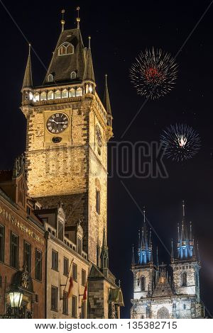 View of old town hall tower and church of Mother of God before Tyn Tyn church in Prague at night. Copy space in black sky.