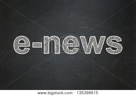 News concept: text E-news on Black chalkboard background