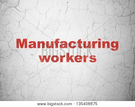 Manufacuring concept: Red Manufacturing Workers on textured concrete wall background